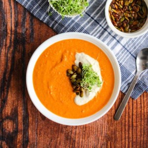 A bowl of tomato chickpea soup on the table ready to eat.