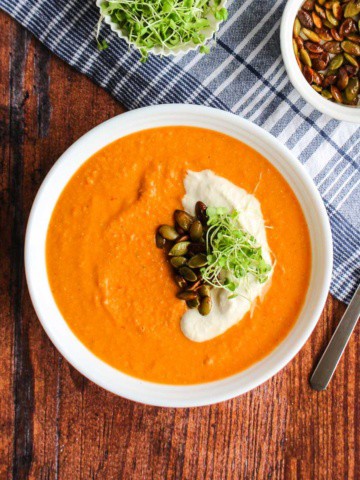 A bowl of tomato chickpea soup on the table ready to eat.