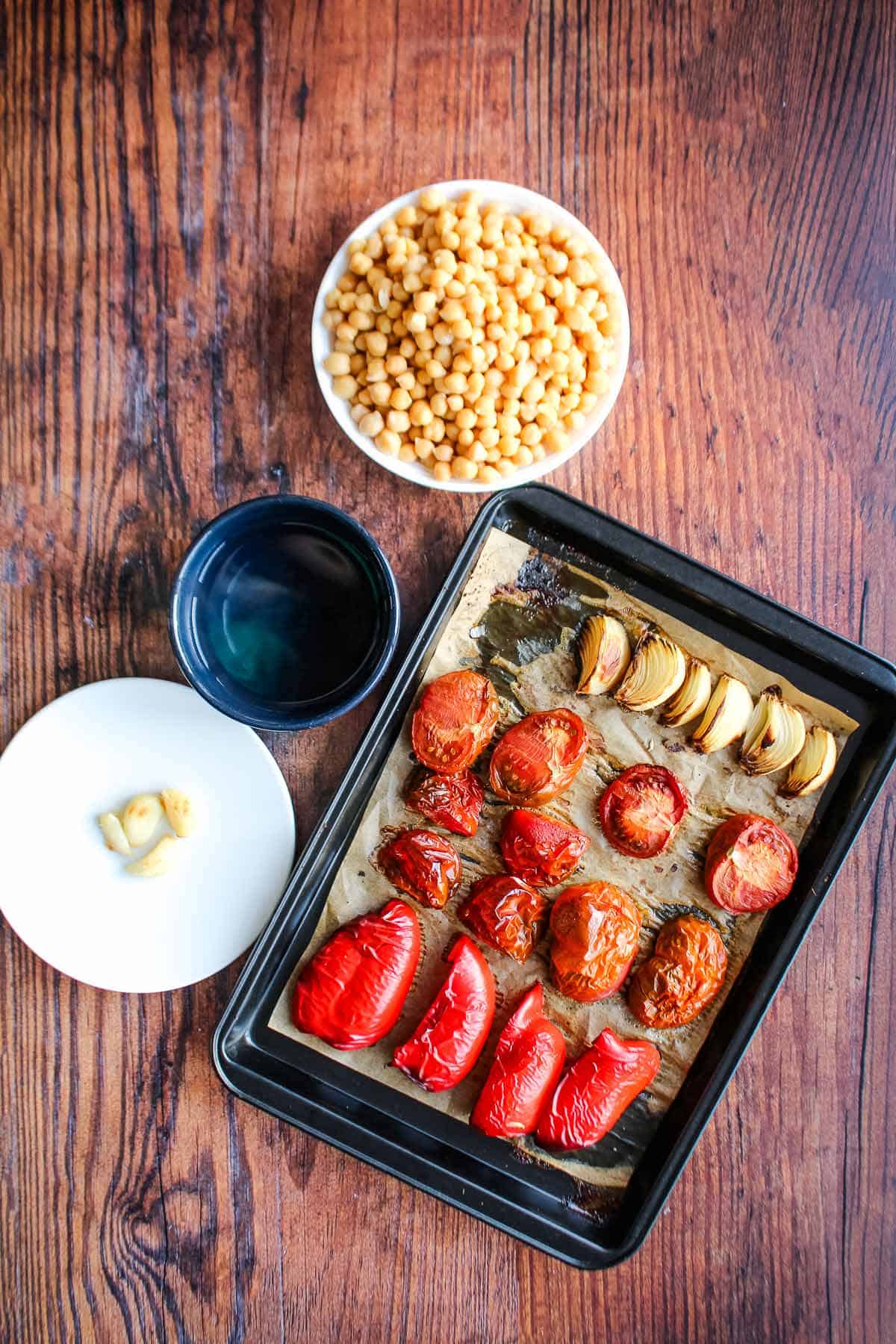 Roasted vegetables on the baking sheet pan after cooking.