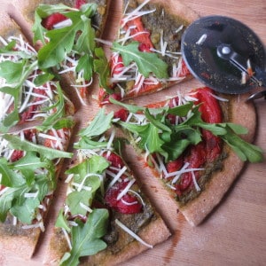 Roasted Red Pepper and Pesto Pizza with Whole Wheat Dough, Arugula, and Parmesan Cheese