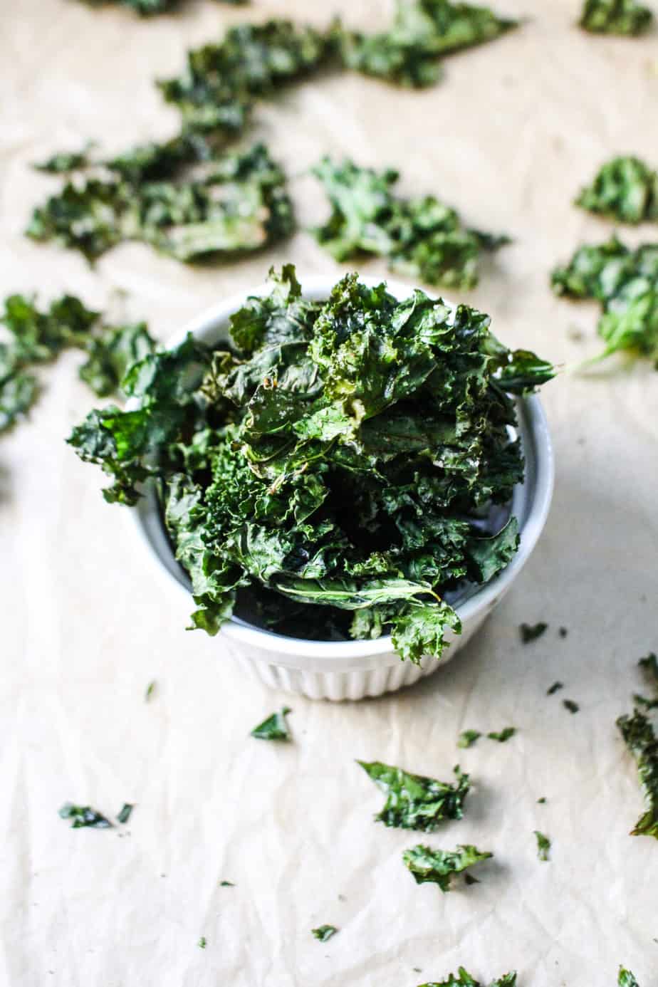 ramekin overflowing with crispy kale chips