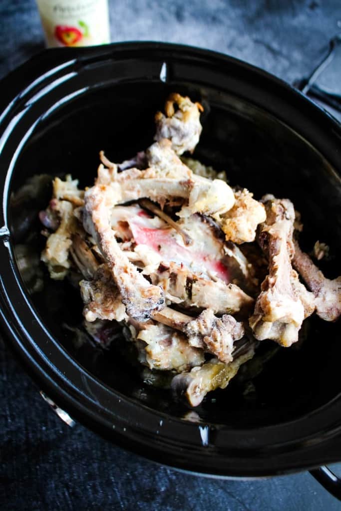 Chicken bones in the slow cooker.