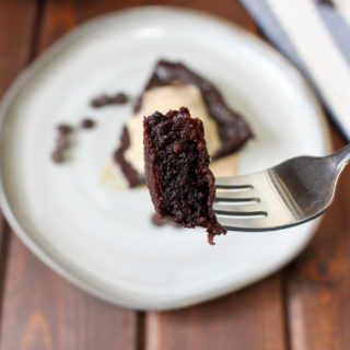 Bite of dark chocolate cake on a fork