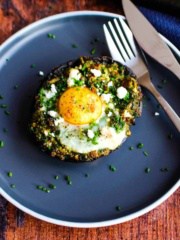 Stuffed breakfast mushrooms on a plate ready to eat.