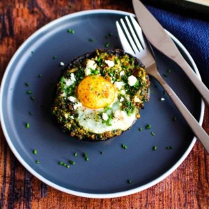 Stuffed breakfast mushrooms on a plate ready to eat.