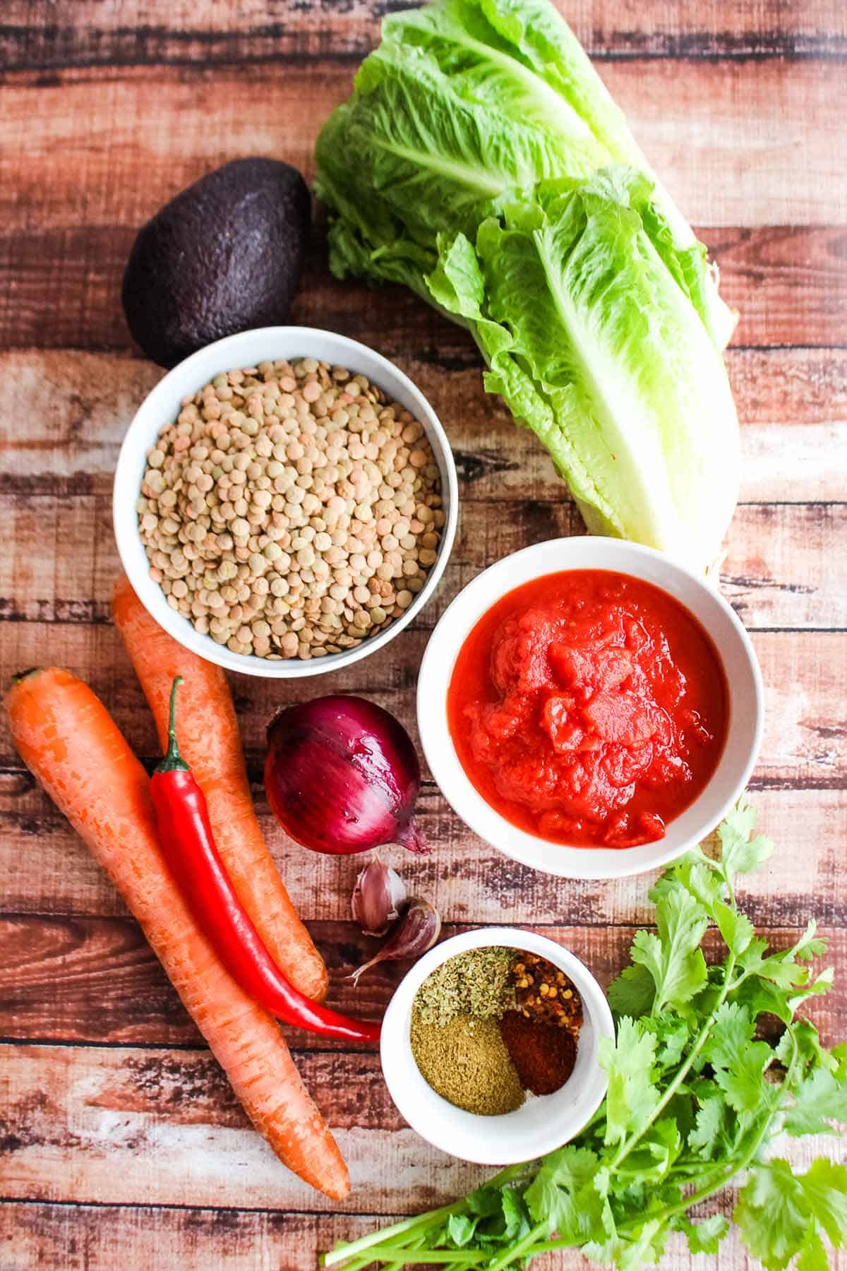 Ingredients to make vegetarian lettuce wraps with lentils on the counter.