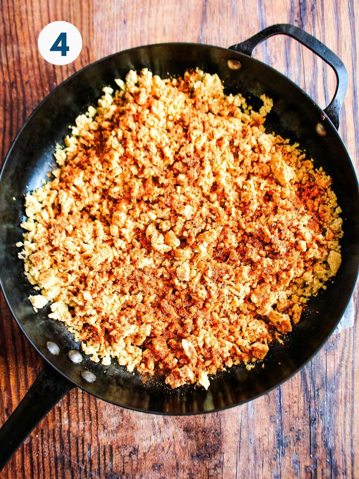 Cooking the chorizo tempeh in a skillet.