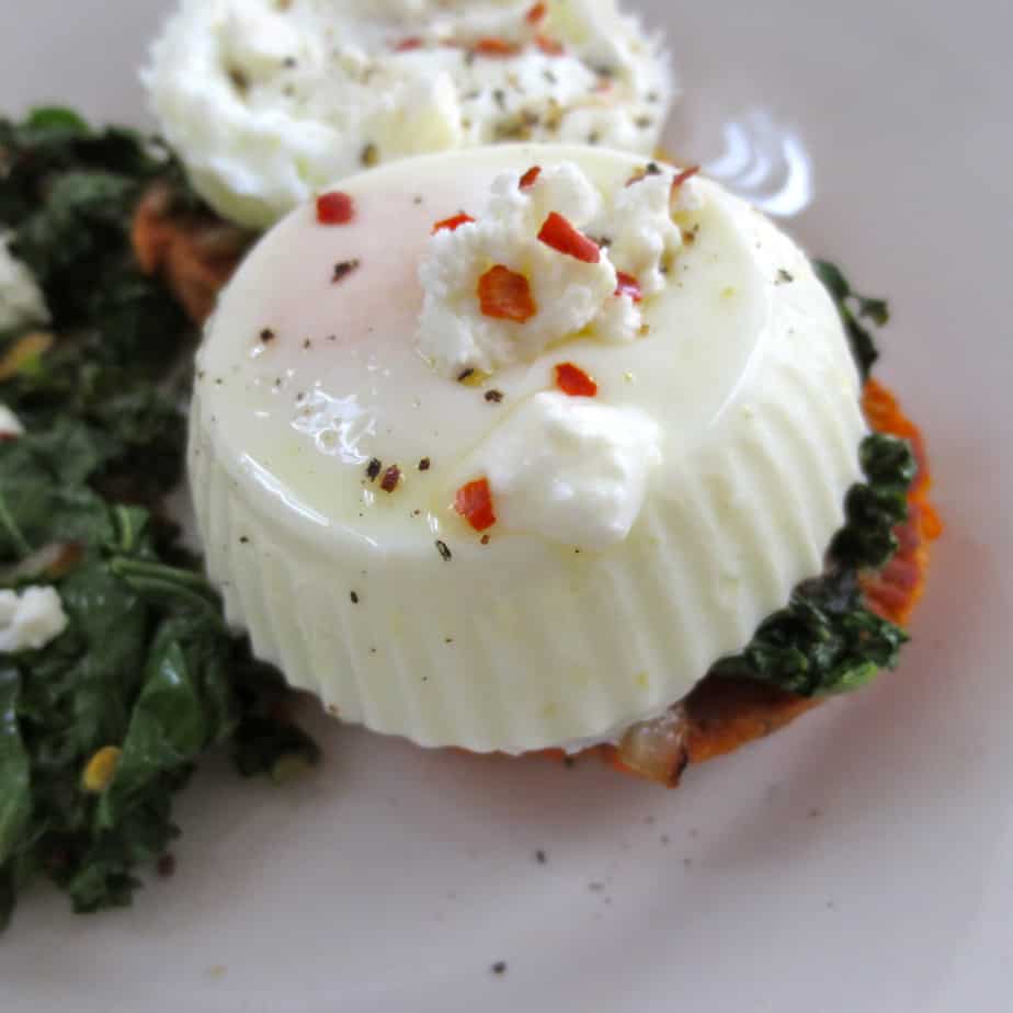 Poached egg over a bed of spinach and kale