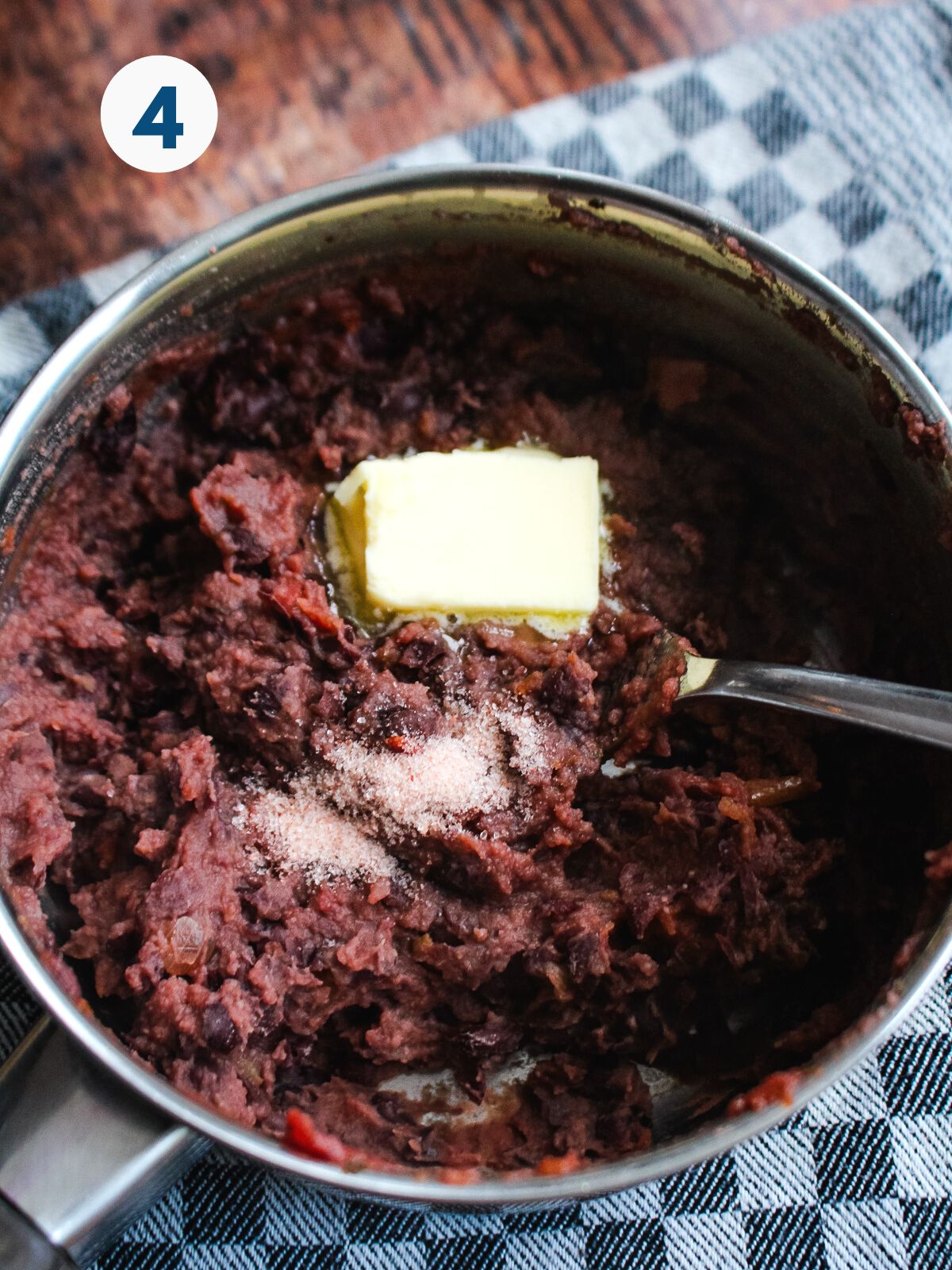 Butter and seasoning added to the mashed beans.