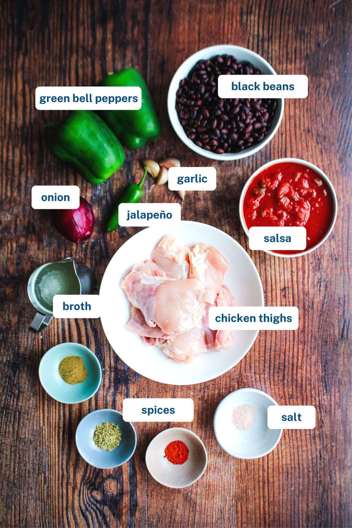 Ingredients to make slow cooker chicken burrito bowls on the table.