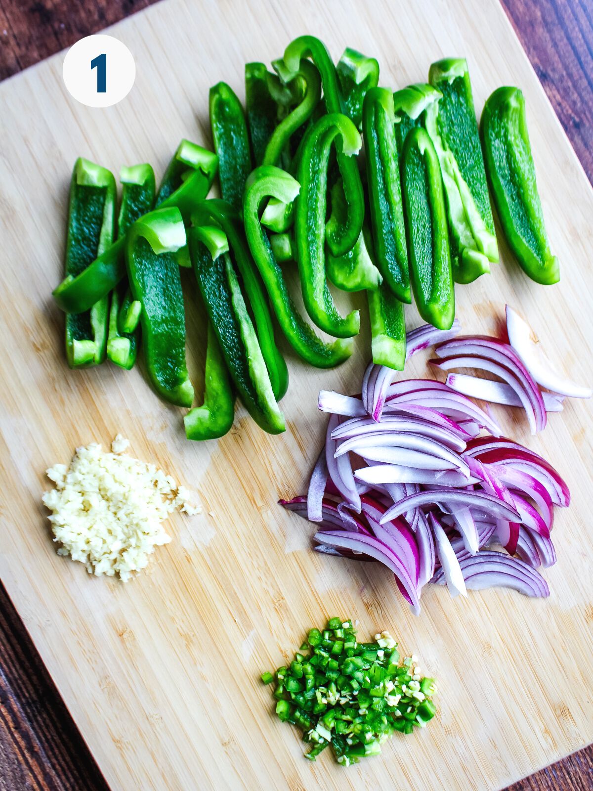 Vegetables for a crockpot burrito bowl on a cutting board.