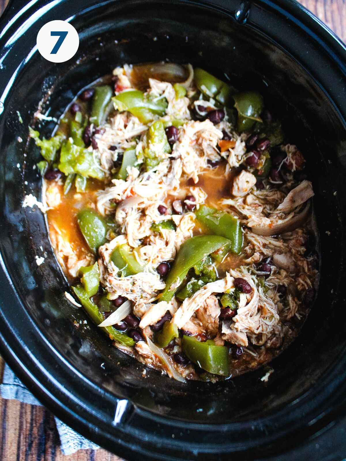 Shredded chicken added back to the pot and mixed with the veggies.