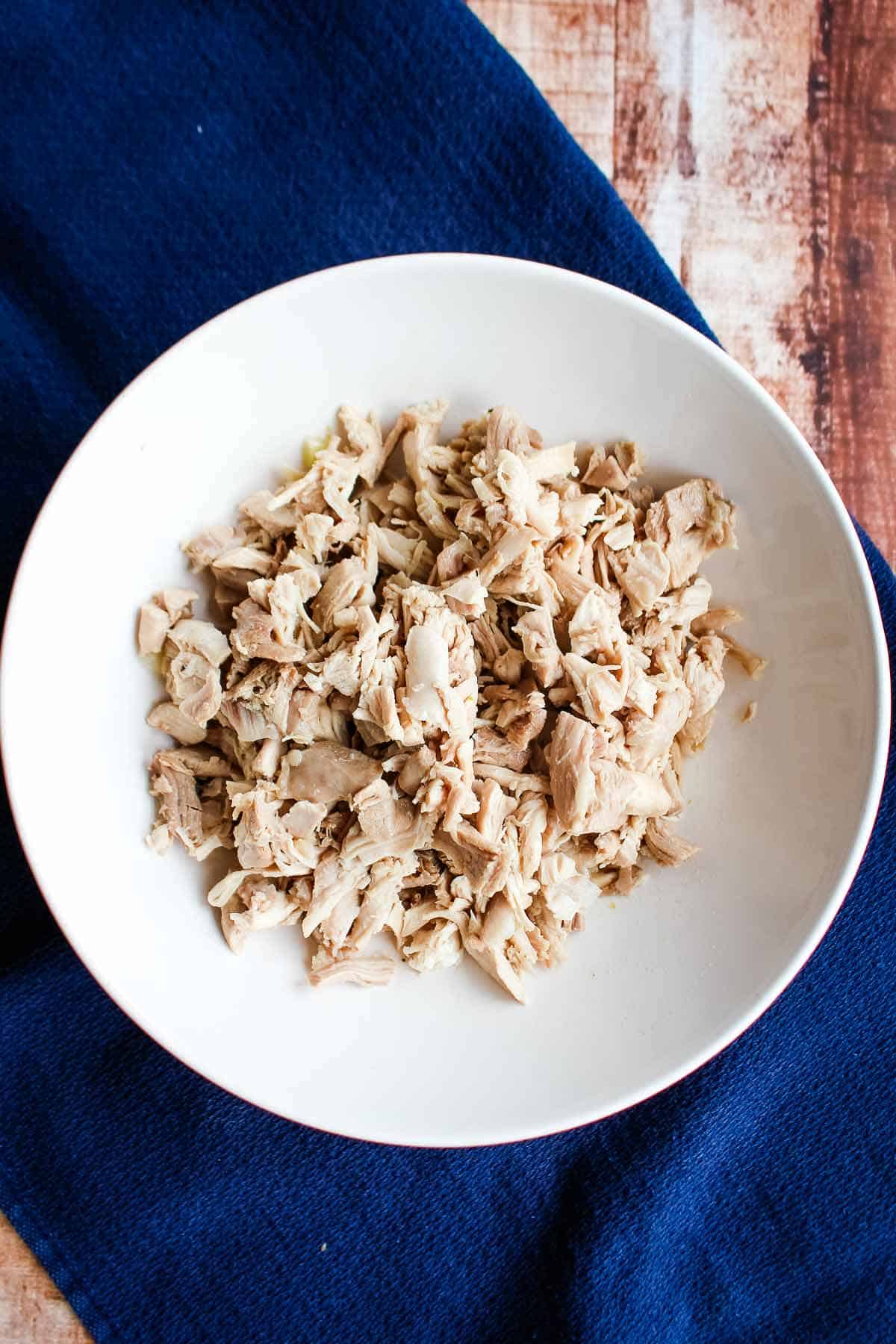 Shredded chicken in a bowl.