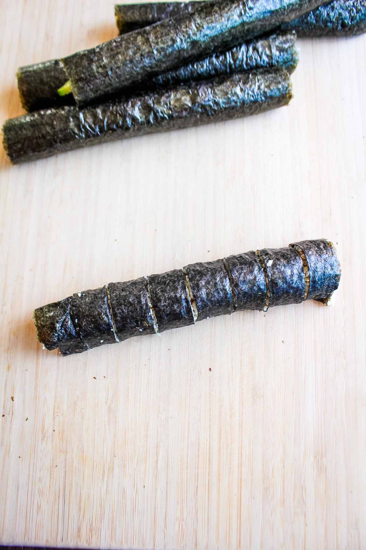 Salmon seaweed roll wrapped and cut into pieces.