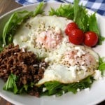Easy Breakfast Salad: arugula, cherry tomatoes, eggs, and homemade crumbled sausage