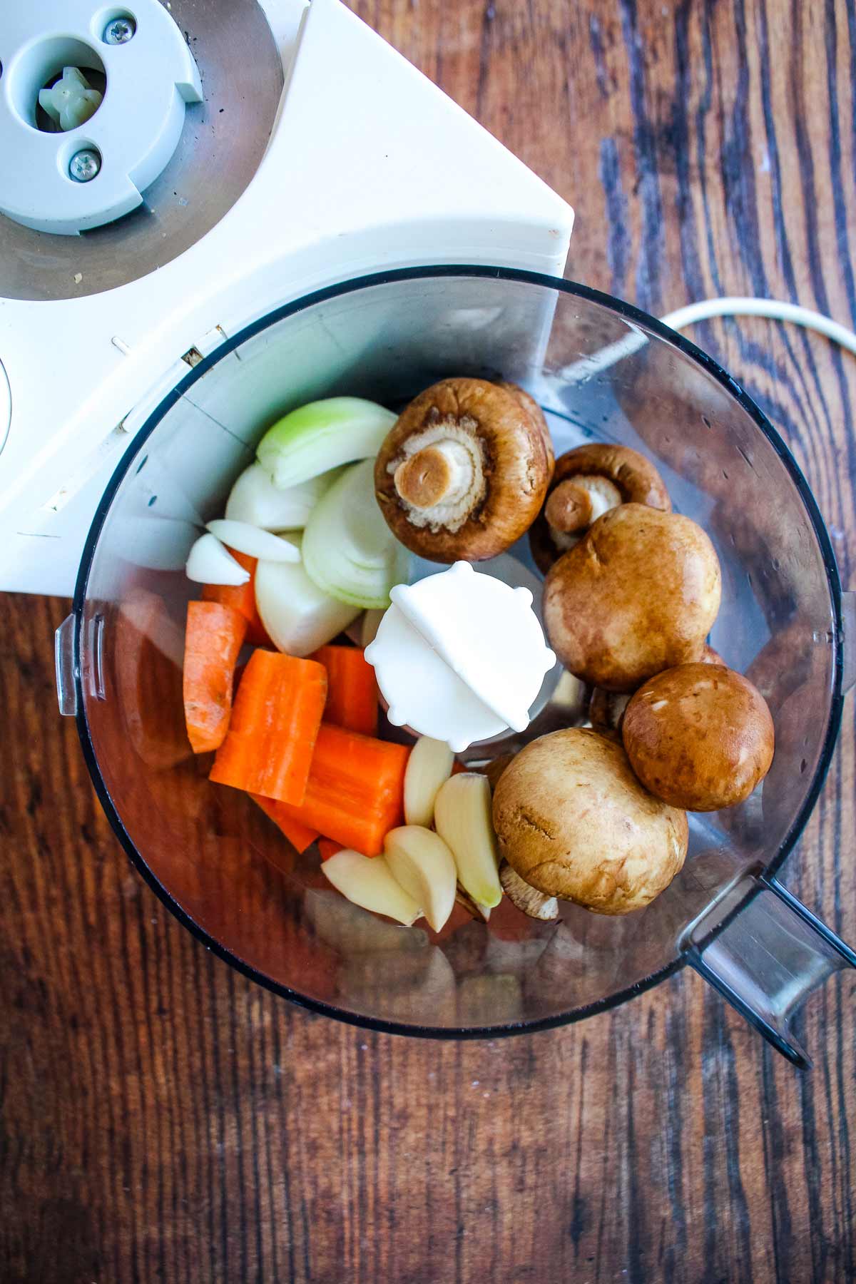 Vegetables in a food processor to make italian sausage bolognese.