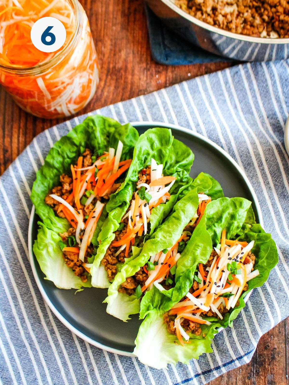Pork lettuce wraps on a plate.