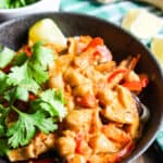 bowl of thai red curry soup with bell peppers and mushrooms