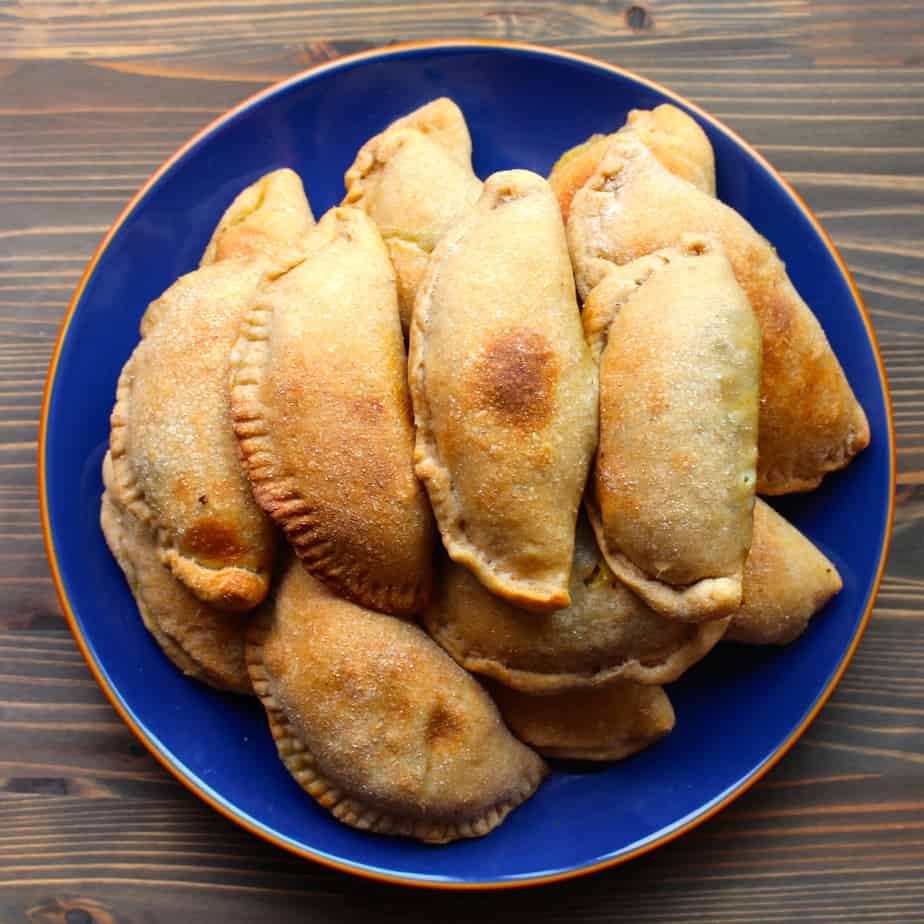 a plate full of mini Breakfast Calzones with Spinach, Sausage, Cheese, and Eggs