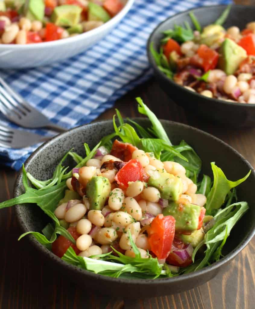 Bacon Avocado Salad in bowls on a picnic table