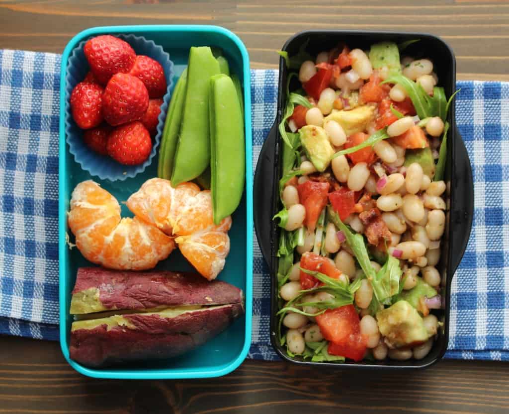 lunch box with fruits, vegetables, and bacon avocado salad