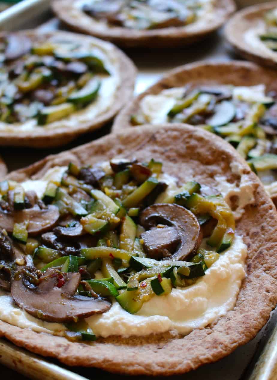 Easy pita pizzas topped with veggies and ricotta