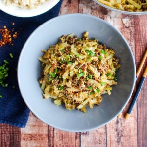 Cooked ground beef and cabbage recipe served in a bowl.