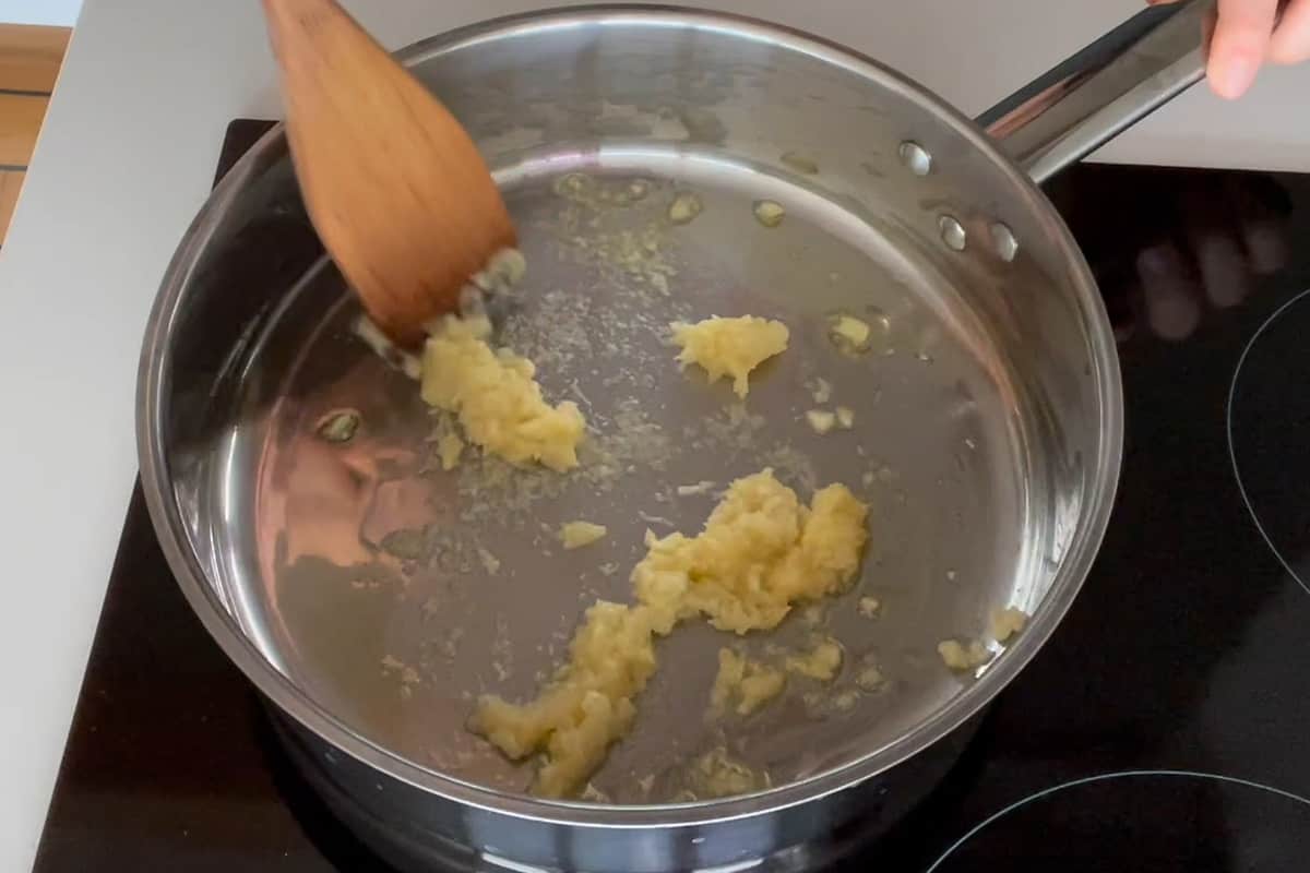 Cooking the garlic in a pan.