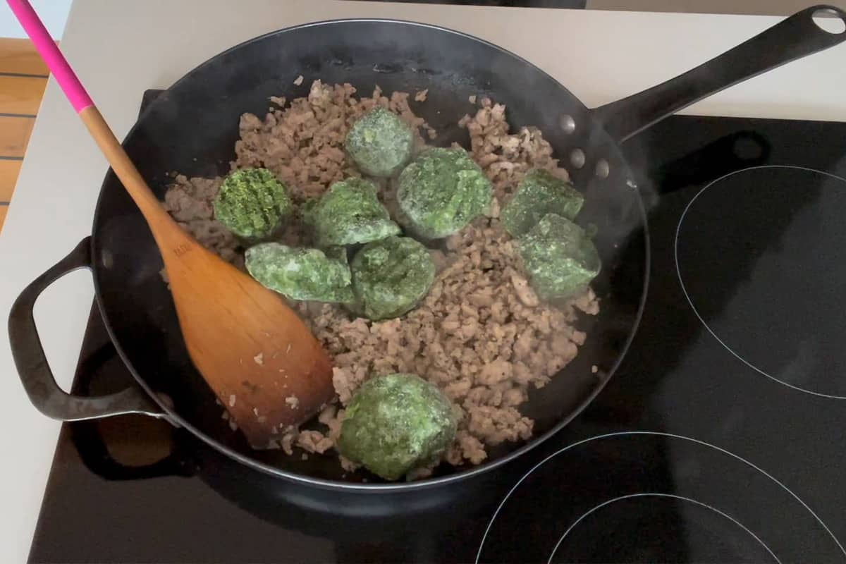 Frozen spinach added to the ground beef.