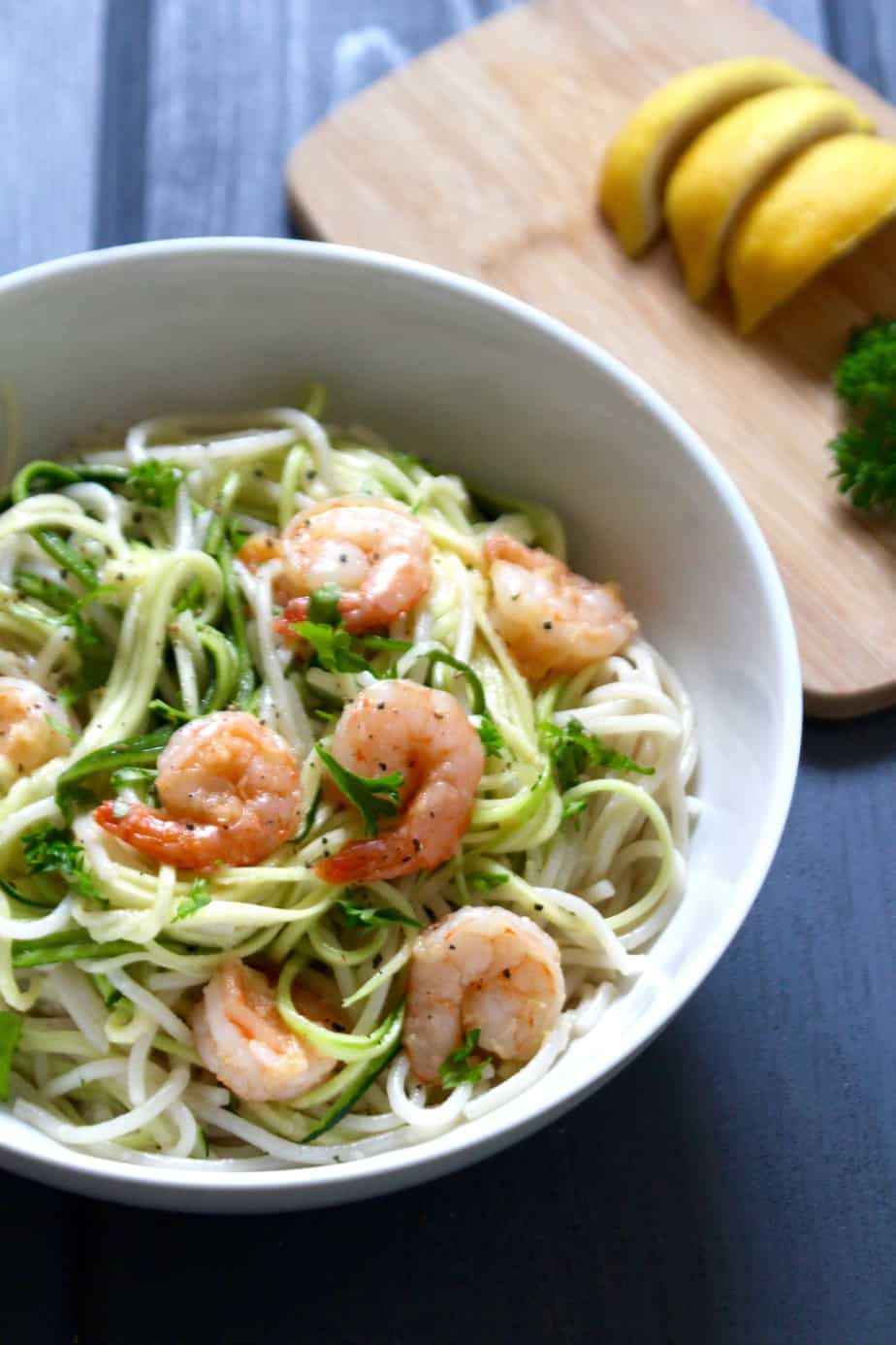 Coconut garlic shrimp with zoodles in a white bowl 