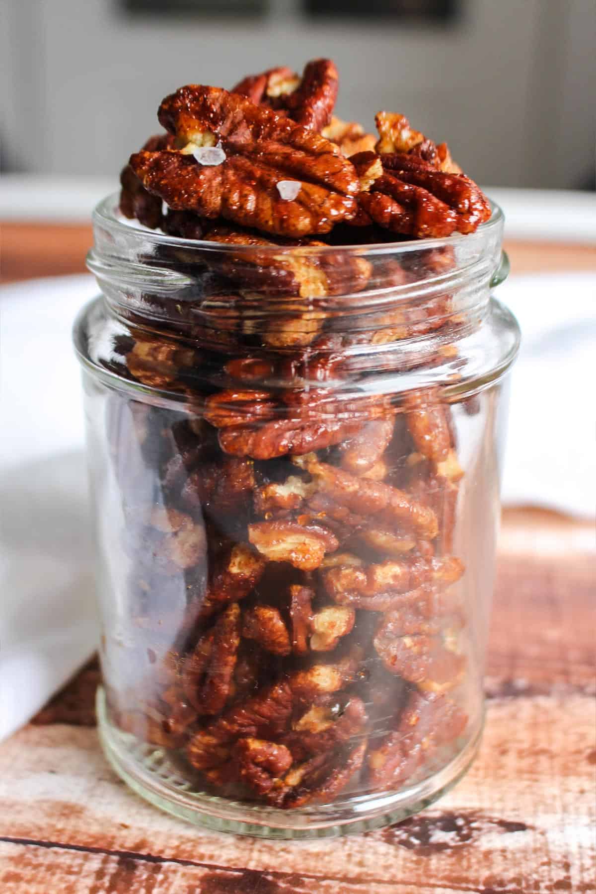 Jar of spicy candied pecans.