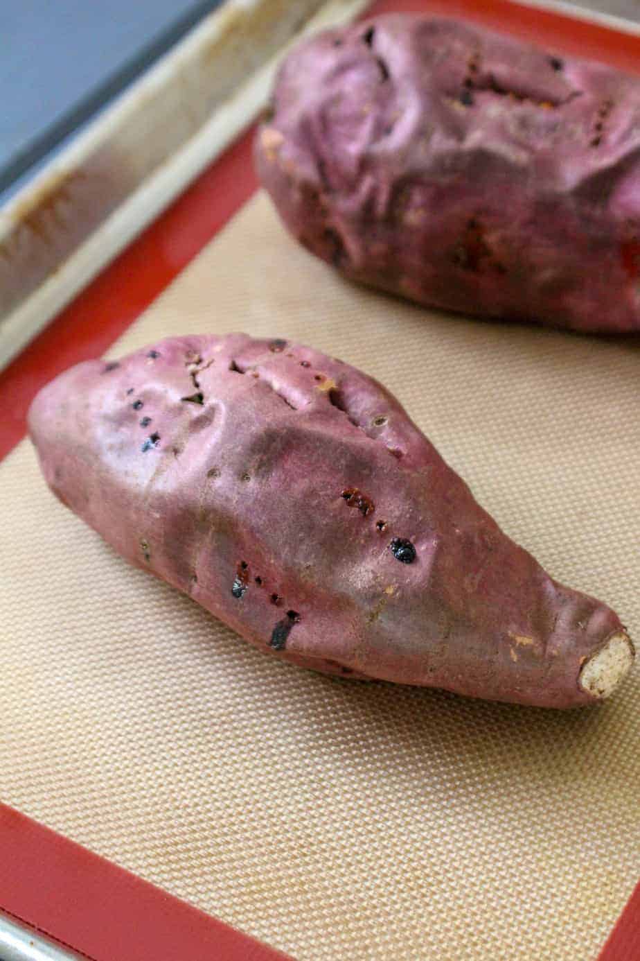 a baked sweet potato with fork holes in it