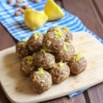 A stack of lemon protein balls on a cutting board.