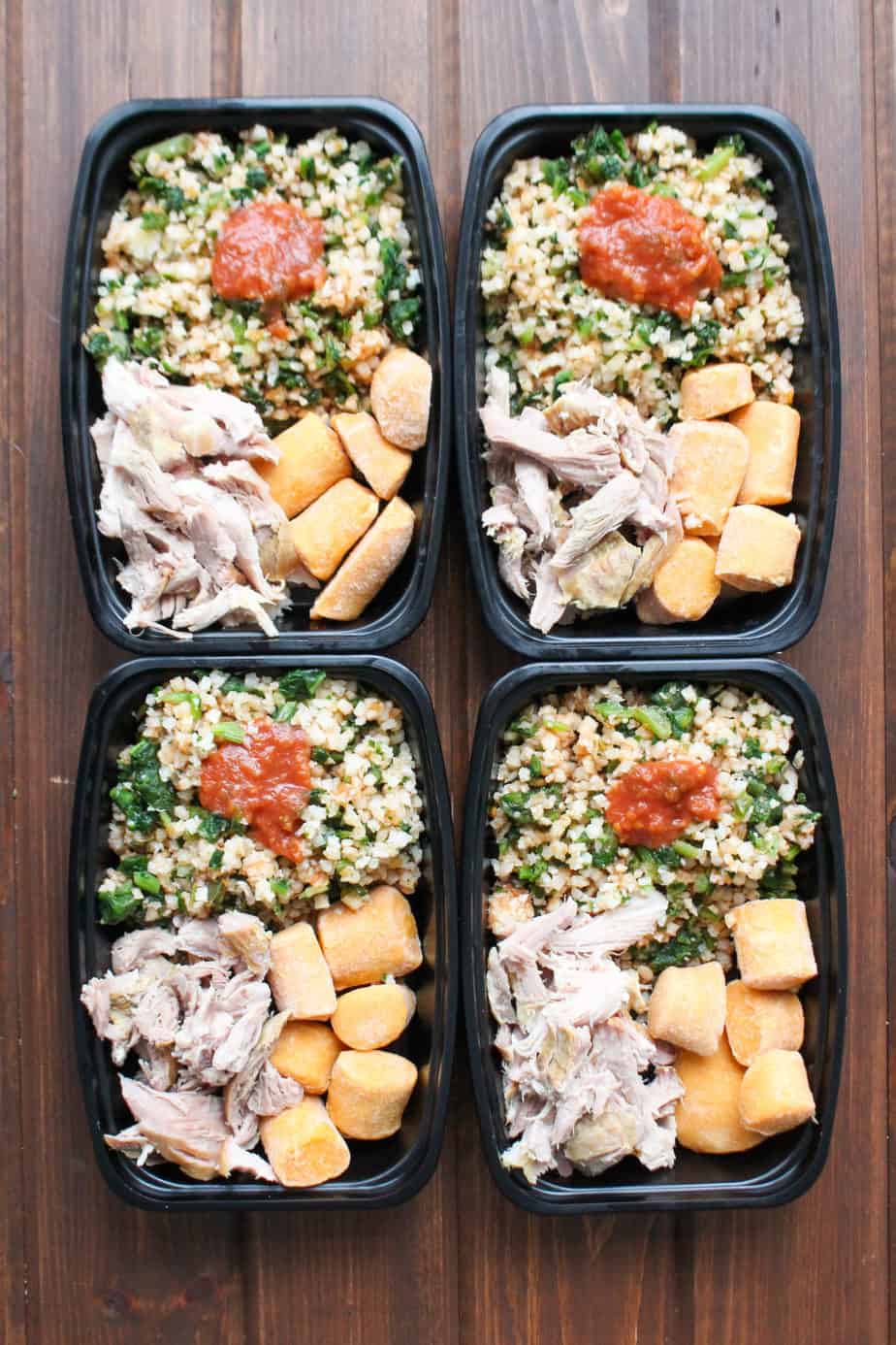 Whole30 Frozen Pork Carnitas Meal Prep Bowls with Trader Joes ingredients all portioned in their own container.