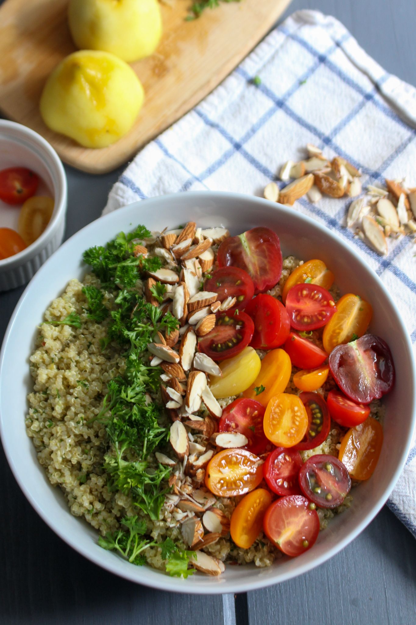 Quinoa salad with parsley, almonds, heirloom tomatoes, and a lemon.