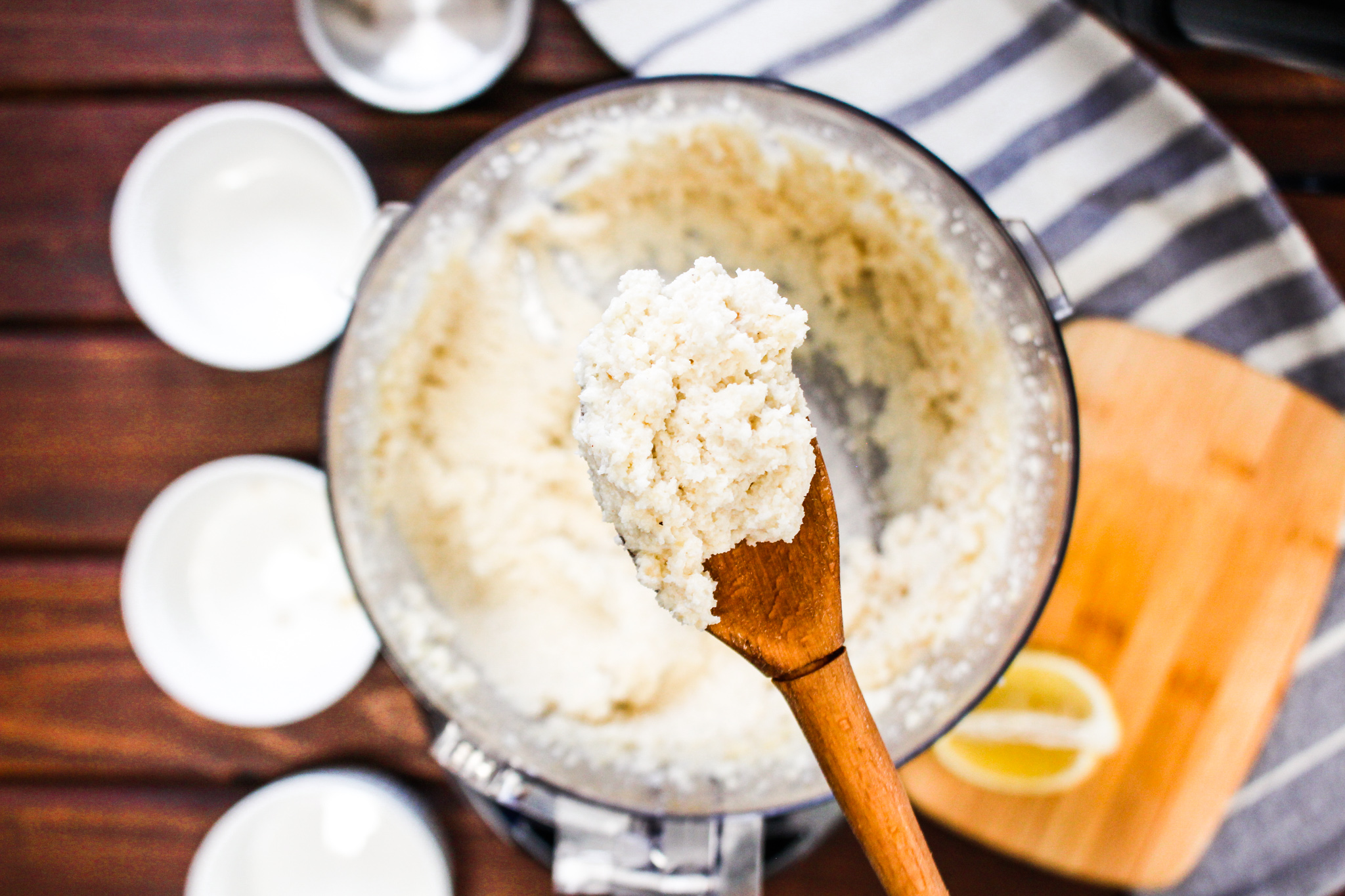 Photo of dairy-free Macadamia Cauliflower Ricotta on wooden spoon