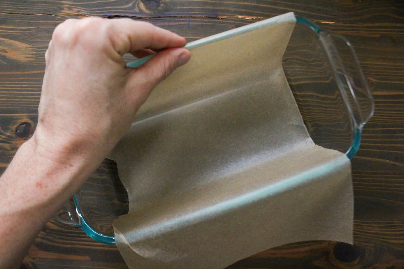 lining a loaf pan with parchment paper