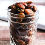 clear glass jar with rosemary almonds