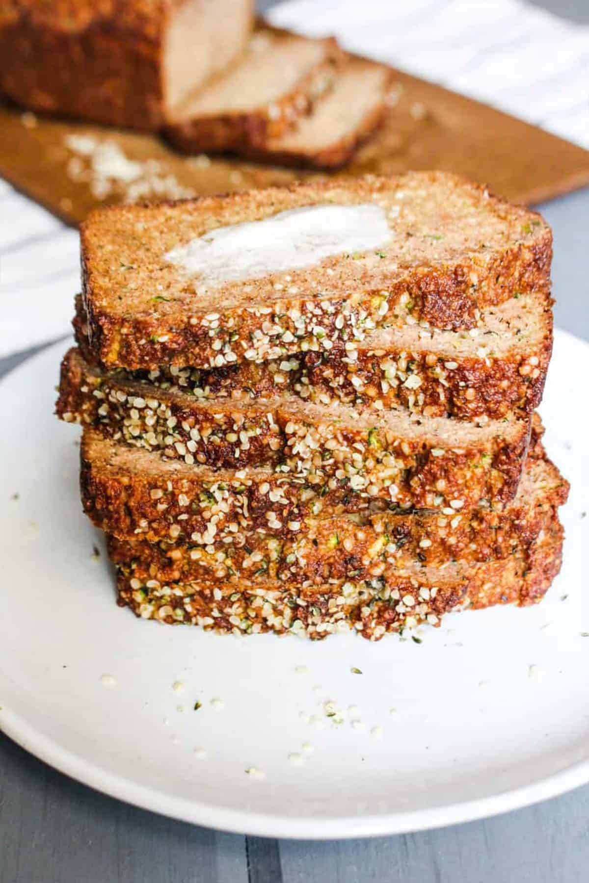 A stack of of low sugar zucchini bread on a white plate.