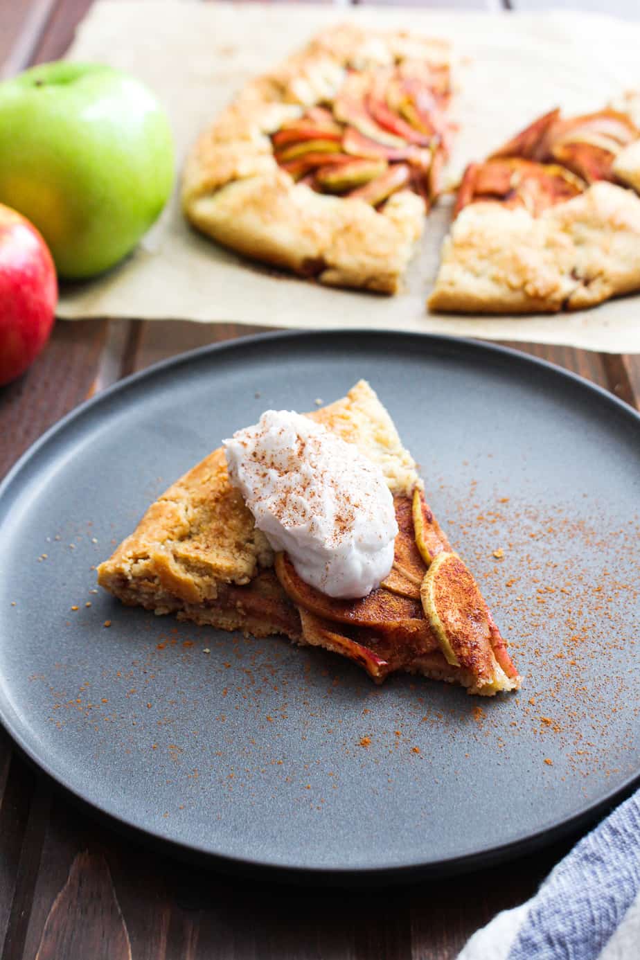 apple pie galette on plate with whipped cream