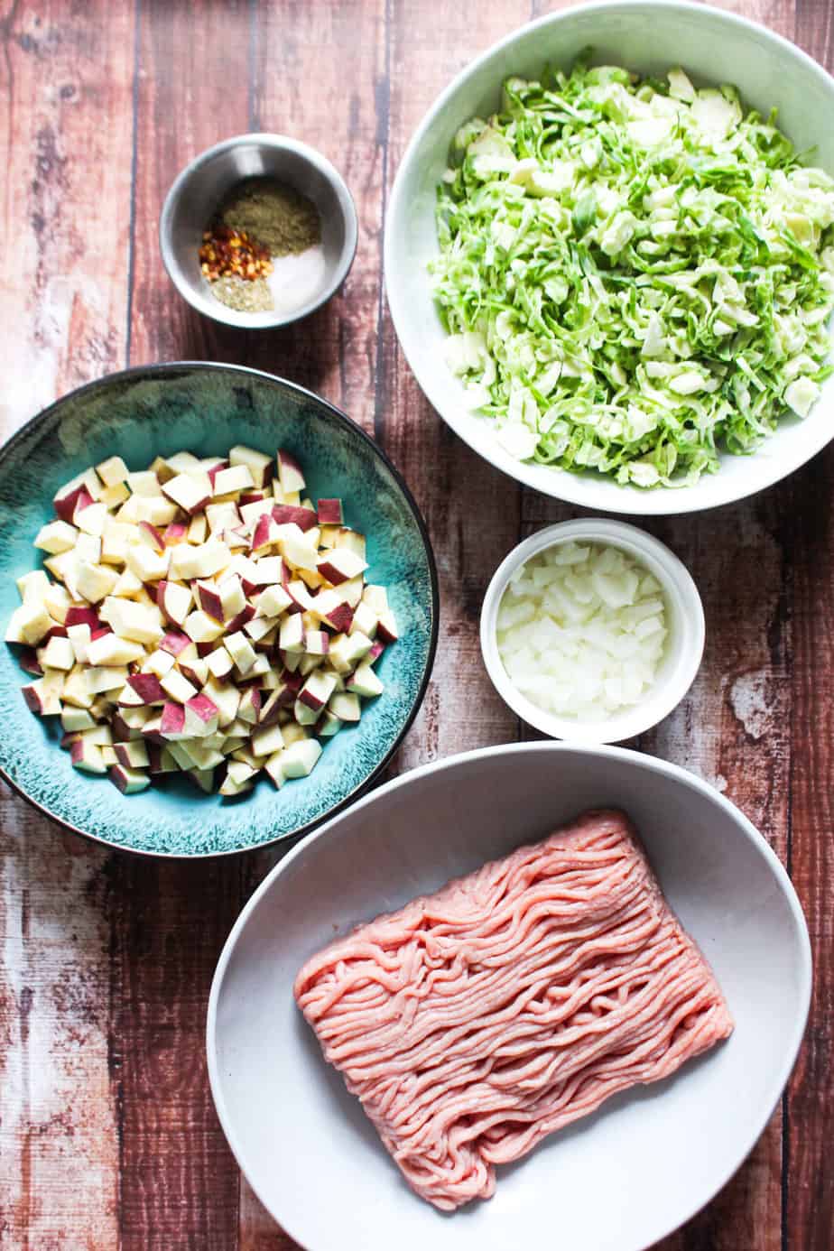 ingredients: raw ground turkey, white onion, cubed sweet potato, spices, and shredded brussels sprouts