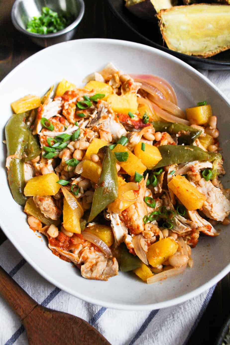 bowl of slow cooker chicken, barbecue sauce, pineapple, and vegetables