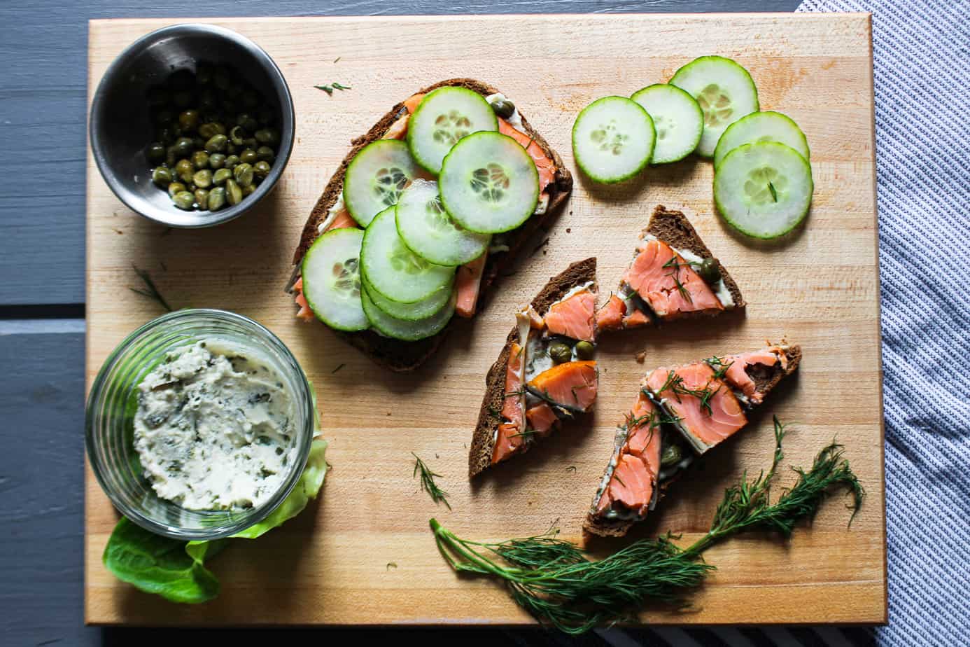 cutting board with smoked salmon toasts