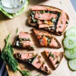 cutting board with smoked salmon toasts