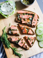 cutting board with smoked salmon toasts