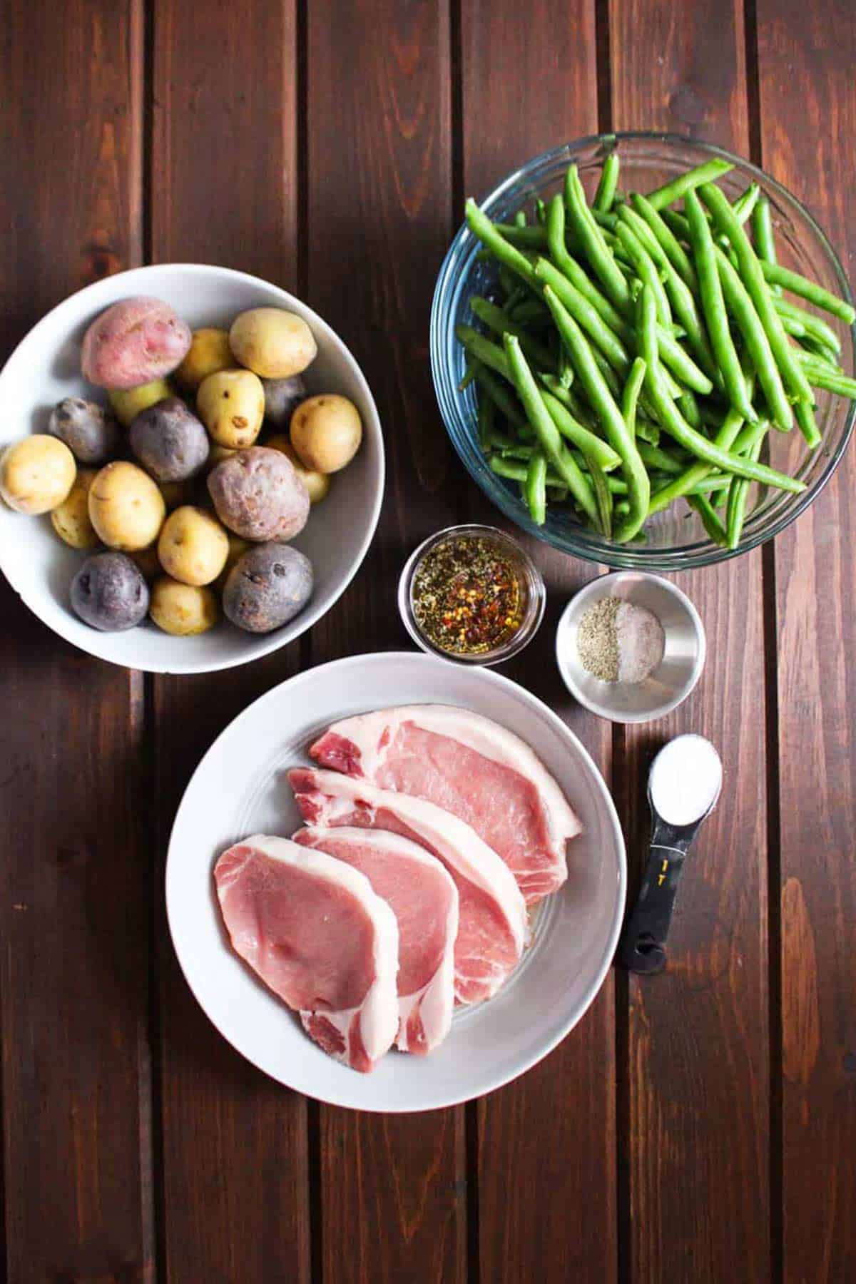 Ingredients for slow cooker pork chops on the table.