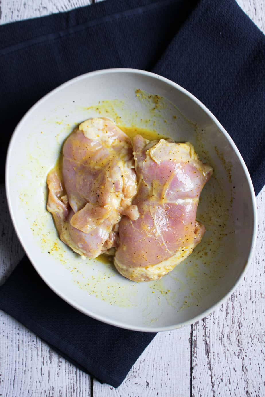 chicken thighs marinating in honey mustard dressing