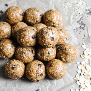 crumpled parchment paper background with a pile of cookie dough bites