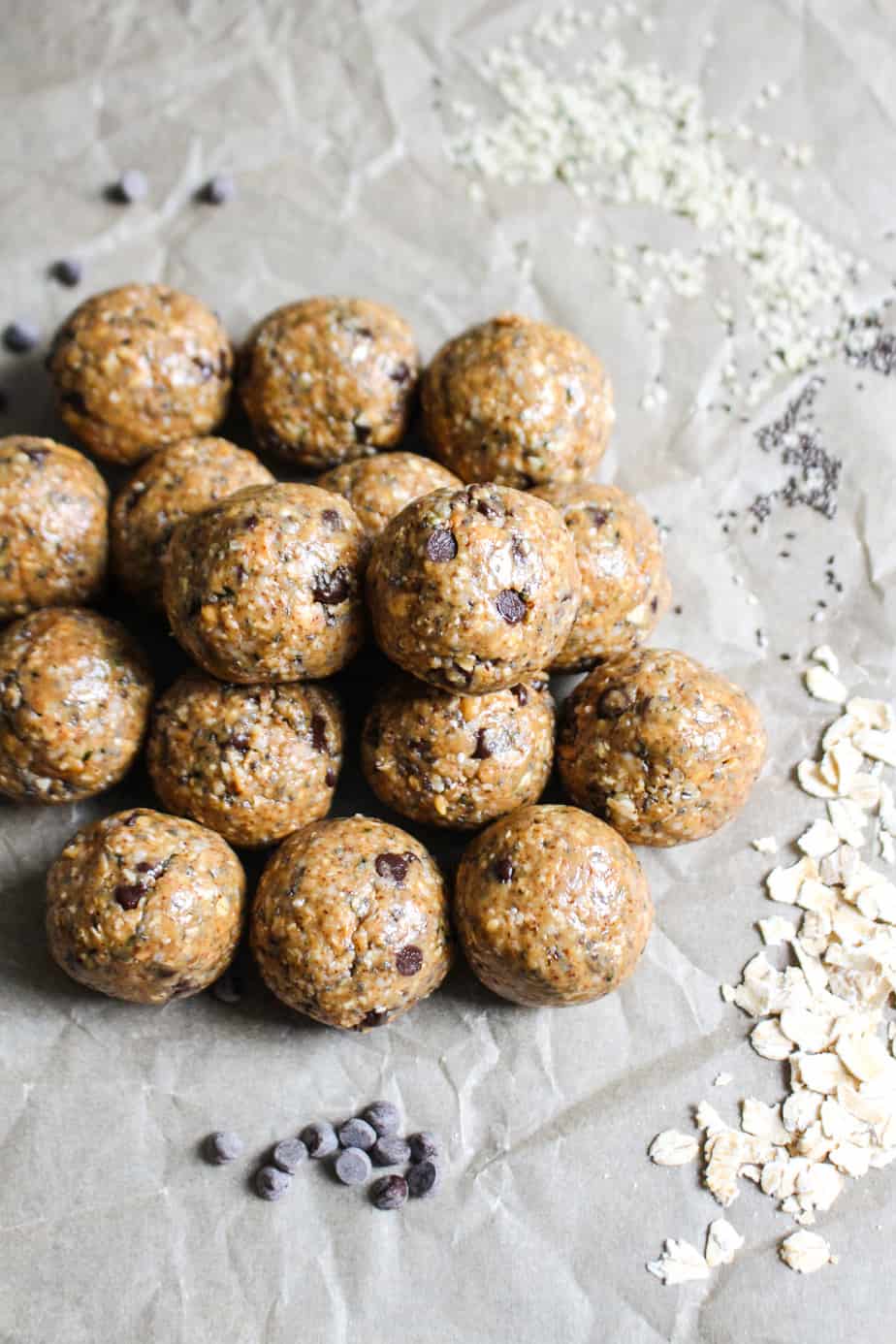 crumpled parchment paper background with a pile of cookie dough bites