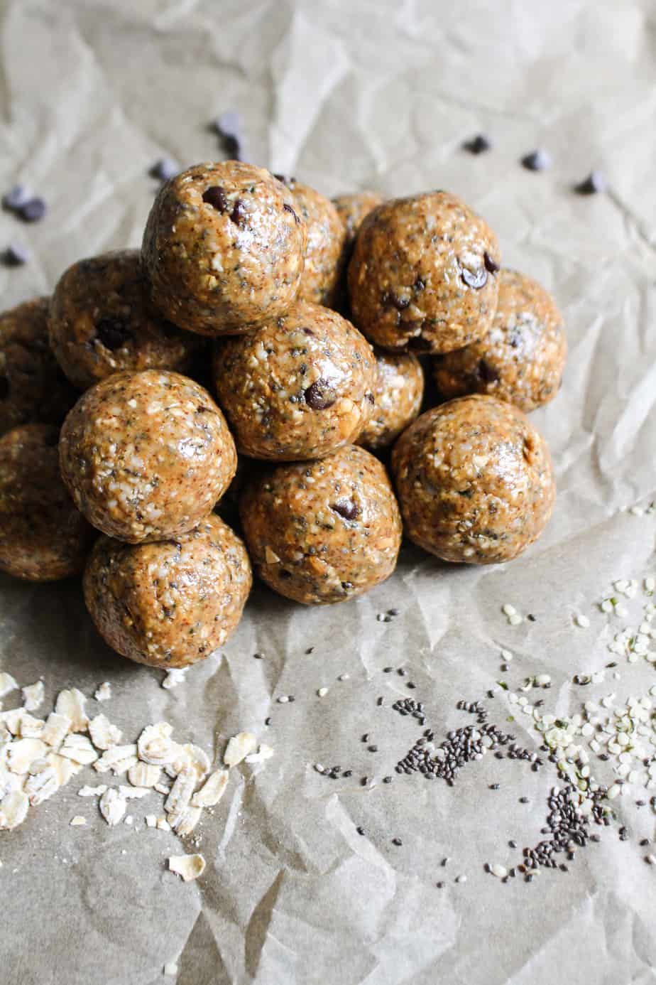 crumpled parchment paper background with a pile of cookie dough bites